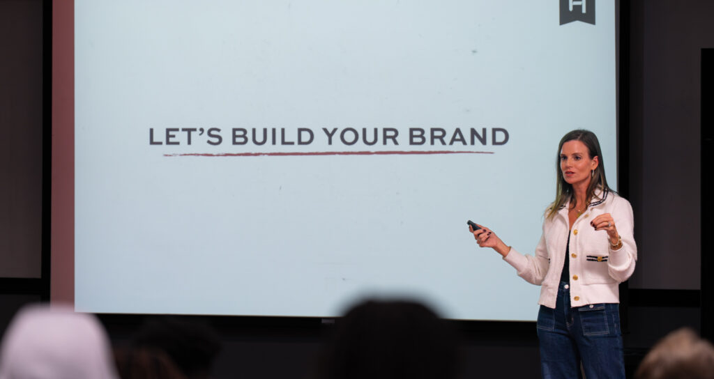 Speaker presenting about building a personal brand during a workshop or class.