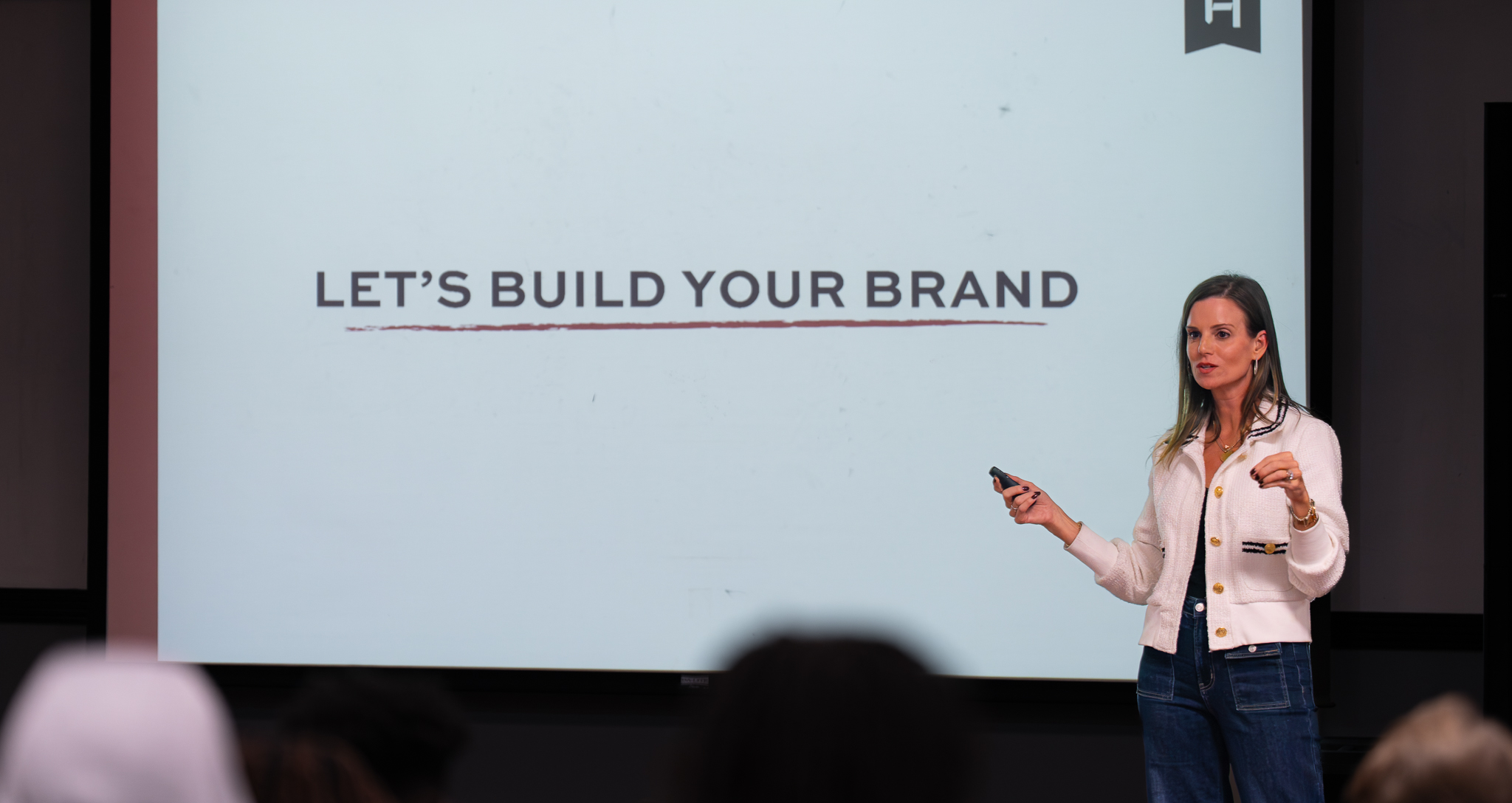 Speaker presenting about building a personal brand during a workshop or class.