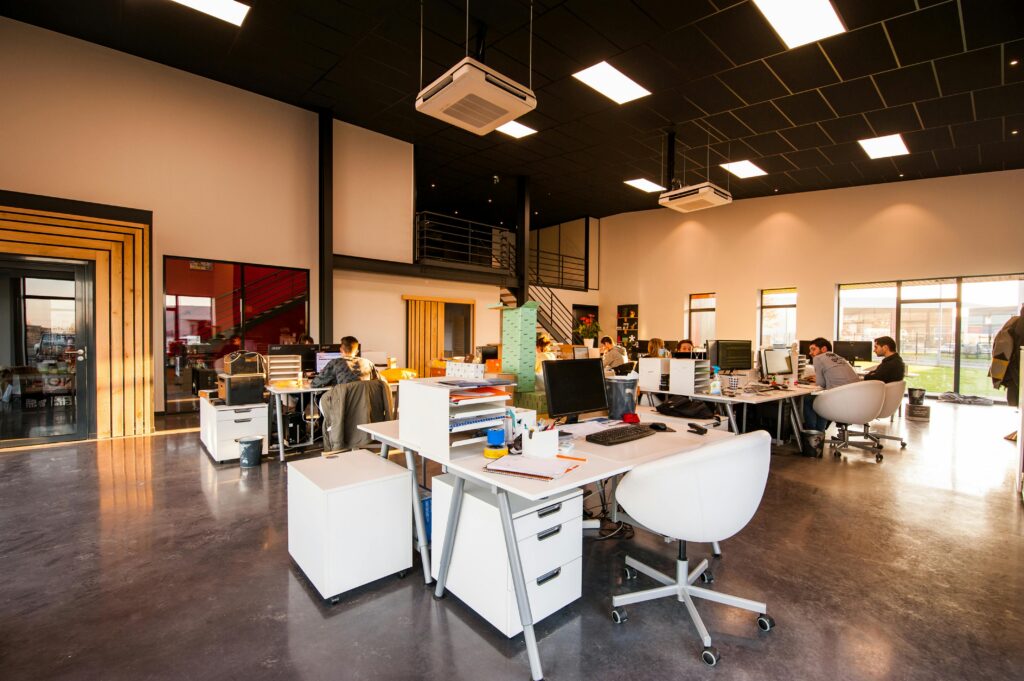 Modern open office workspace with marketing and creative professionals collaborating.